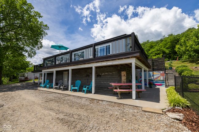 rear view of property featuring a wooden deck | Image 59