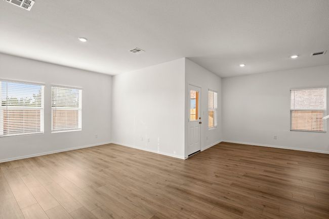 Empty room featuring visible vents and wood finished floors | Image 7