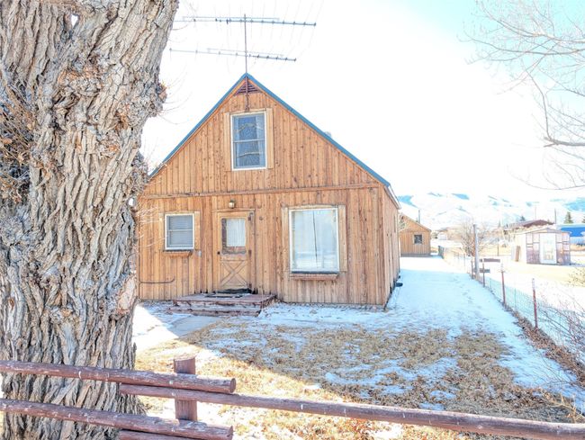 View of snow covered property | Image 24