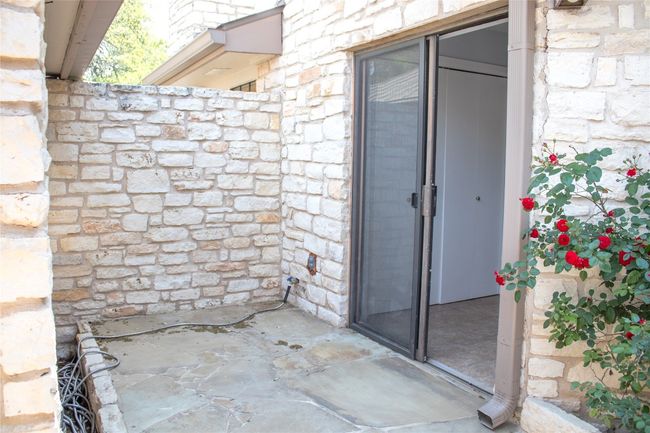 Property entrance featuring stone siding | Image 6