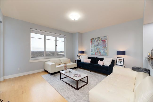 Living area with wood finished floors and baseboards | Image 4