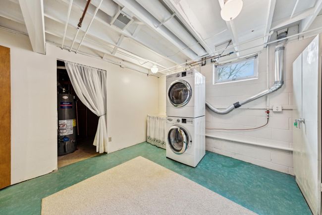Lower level laundry room with a deep soaking sink | Image 20