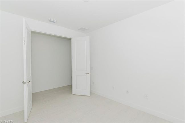 Unfurnished bedroom with baseboards | Image 11