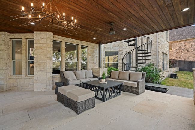 View of patio / terrace with stairs, an outdoor hangout area, and fence | Image 34