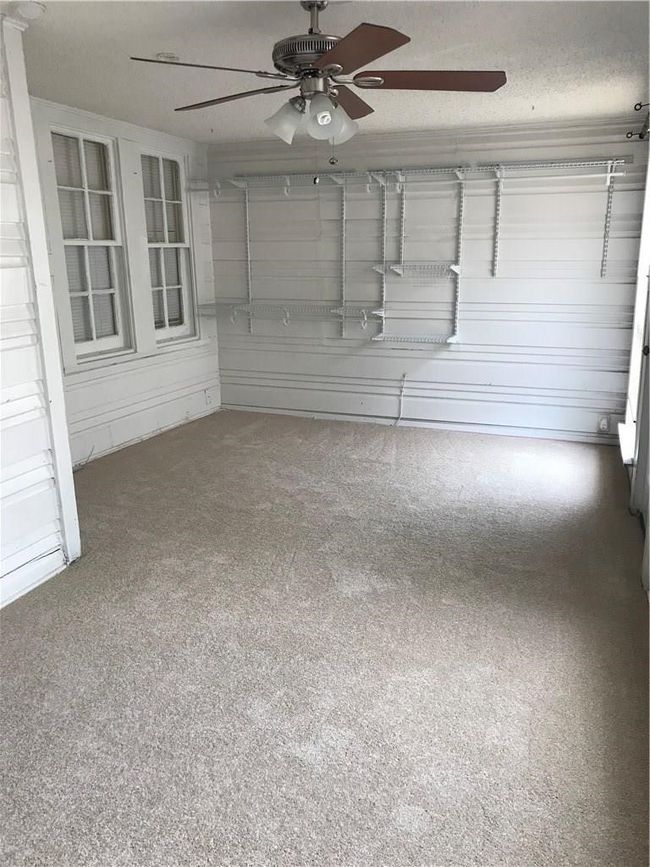 View of unfurnished sunroom | Image 11