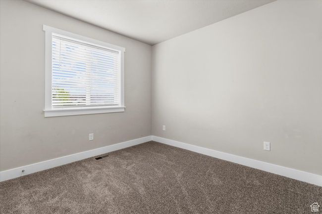 Empty room featuring carpet and baseboards | Image 27