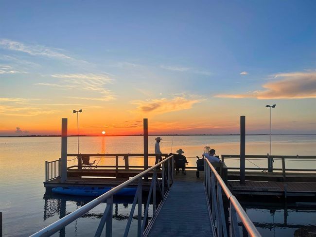 When the sun sets over Drum Bay, the pier transforms into one of the most peaceful places on the Texas Gulf Coast. Whether you’re casting a line or kicking back with friends, these golden hour moments are what make Seahorse Estates unforgettable. | Image 27