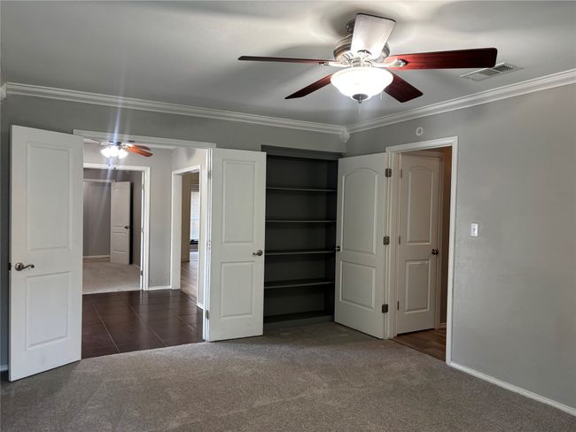 Primary bedroom with built in bookshelves | Image 16