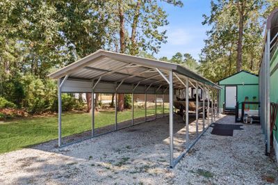 Versatile covered carport for secure parking, great for cars, boats, and golf carts. | Image 3