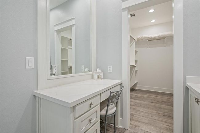 The primary bathroom includes a built-in vanity. | Image 34