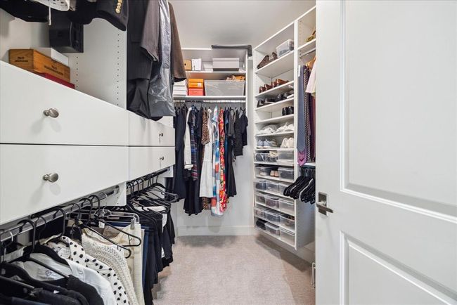 The closet has custom built ins and shelves and drawers for all of those extras. | Image 21