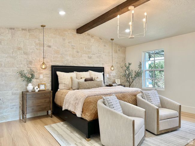 Bedroom with light wood-type flooring, a chandelier, a multi sided fireplace, and a textured ceiling | Image 19