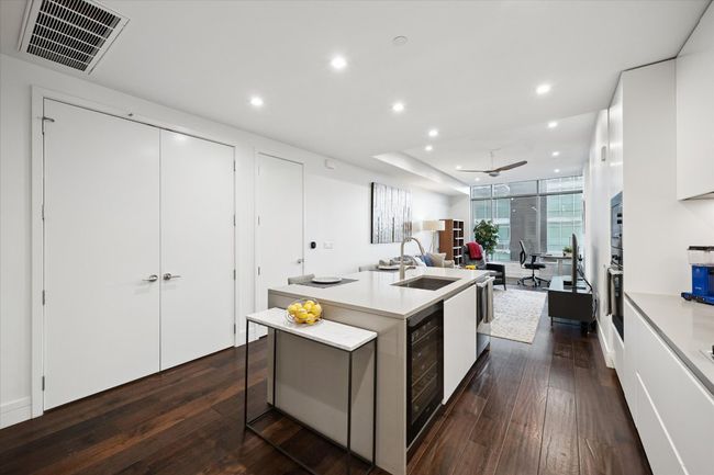 Chefs kitchen with state of the art appliances and large kitchen island | Image 6