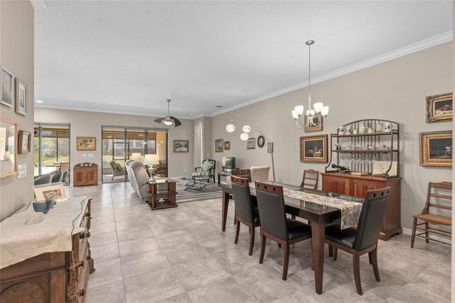 View of the Dining Room and Family Room. This home also features 10' Ceilings throughout. | Image 13