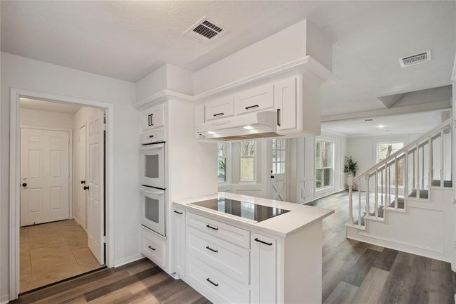 Make entertaining a true delight from this prestigious kitchen that features a double oven and the electric cooktop with more storage. | Image 18