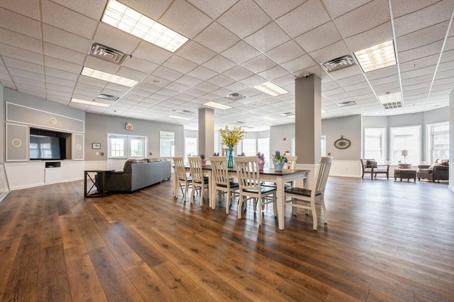 Dining room with visible vents, a drop ceiling, and hardwood / wood-style flooring | Image 17
