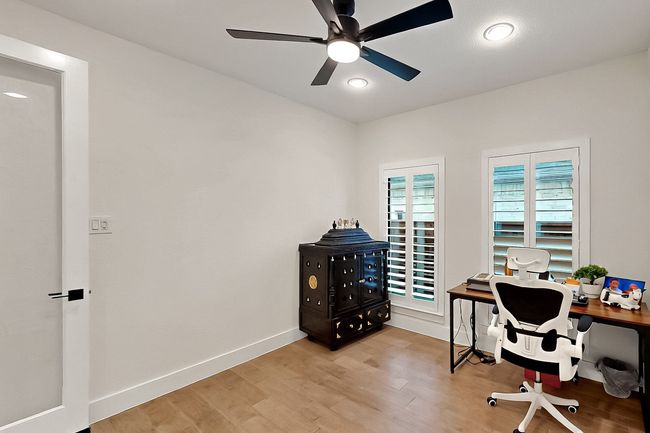 Home office featuring light wood-style floors, a ceiling fan, baseboards, and recessed lighting | Image 32