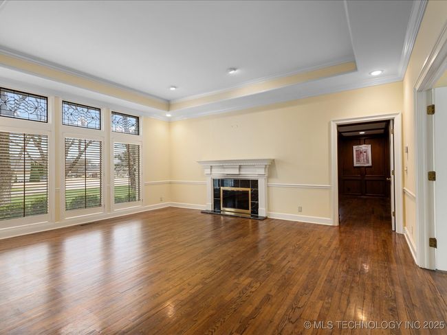 Formal Living Room Wall of windows, Double Fireplace | Image 6