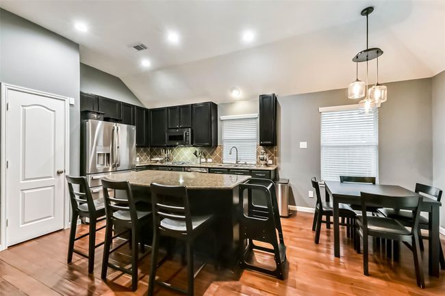 Dine-in kitchen island, new appliances, and space saving microwave/air fryer combination. | Image 10