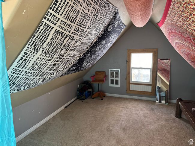 Bonus room featuring lofted ceiling, carpet flooring, and baseboards | Image 31
