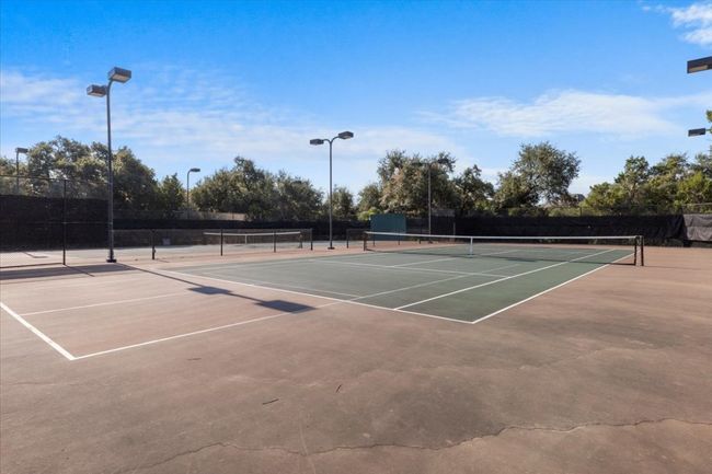 View of tennis court with community basketball court | Image 33