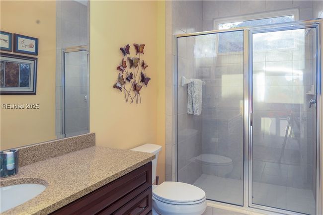 The main bathroom is in the hallway adjacent to the rear Bedroom #3 being used as an office and den. | Image 35