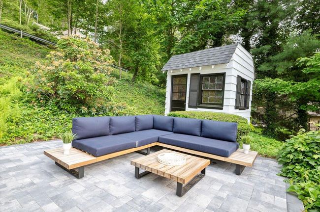 View of patio featuring outdoor lounge area and an outbuilding | Image 33