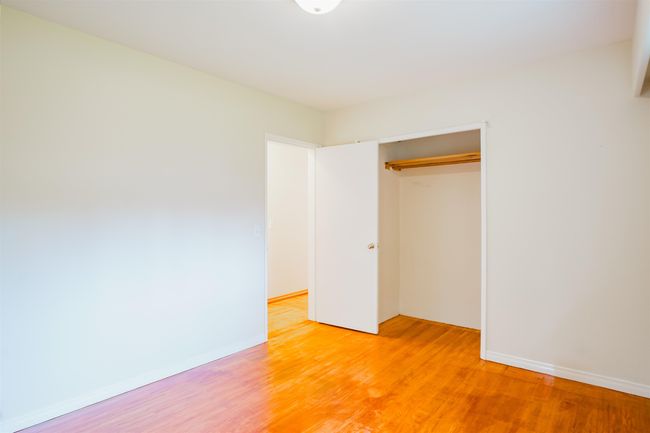 Unfurnished bedroom with a closet, light wood finished floors, and baseboards | Image 15