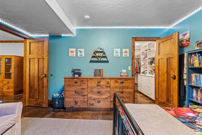 Bedroom with a textured ceiling | Image 42
