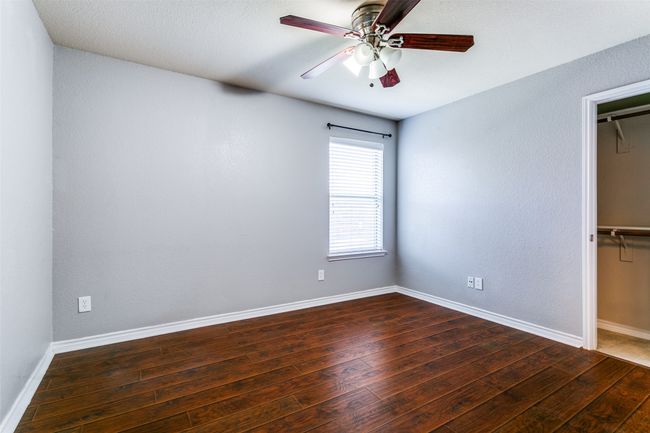 The third bedroom has a window, a ceiling fan, walk-in closet and no carpet!!!! | Image 27