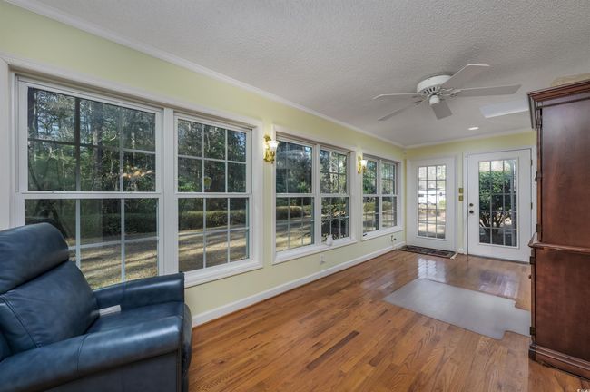 Unfurnished sunroom with ceiling fan | Image 17
