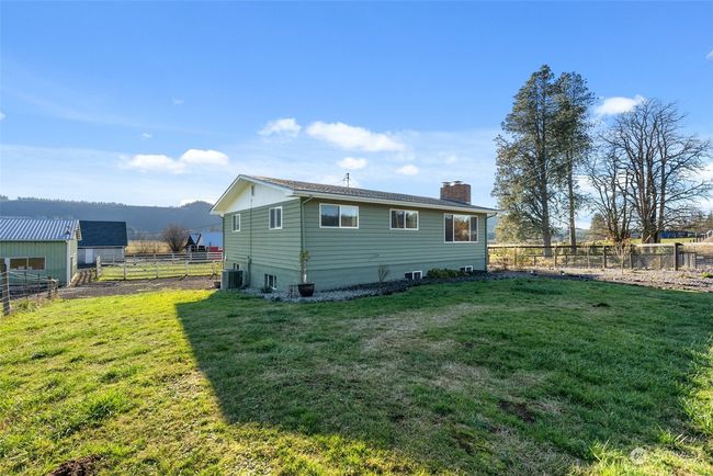 The house is designed for year-round comfort and efficiency, featuring a heat pump to keep summers cool and winters warm. Complemented by new vinyl windows, this home offers energy efficiency, helping you stay comfortable while reducing utility costs | Image 40