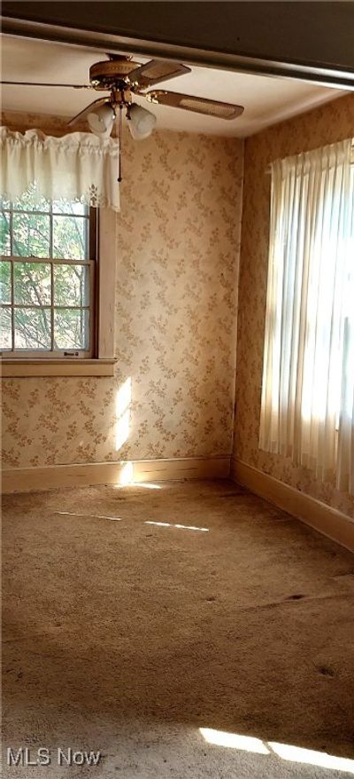 Dining room with carpet flooring and ceiling fan | Image 2