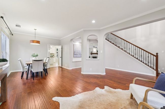 A bright and airy living room perfect for both quiet mornings and vibrant entertaining. | Image 14