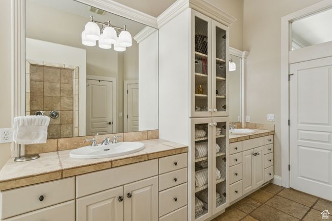 Full bathroom featuring vanity, ornamental molding, and stone finish floors | Image 34