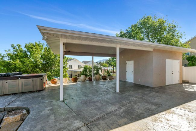 View of patio featuring a hot tub | Image 25