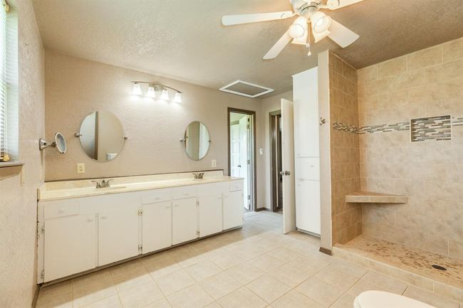 Bathroom Upstairs features Double Sinks and a fantastic walk-in shower. | Image 39