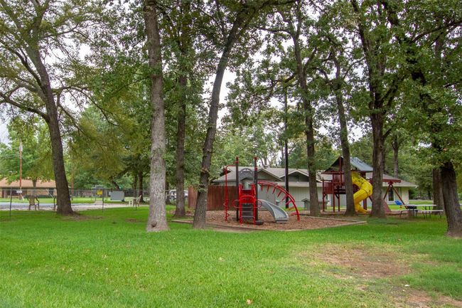 Enchanted Oaks community playground also walking distance next to pool. | Image 27