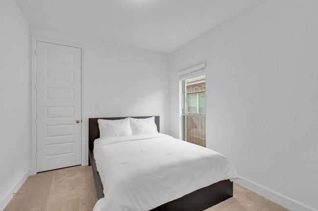 Bedroom featuring light colored carpet and baseboards | Image 25
