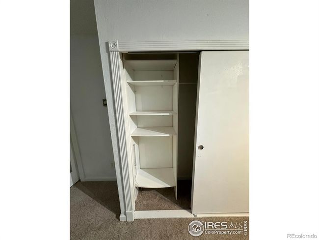 Built in closet shelving in the bedroom. | Image 12
