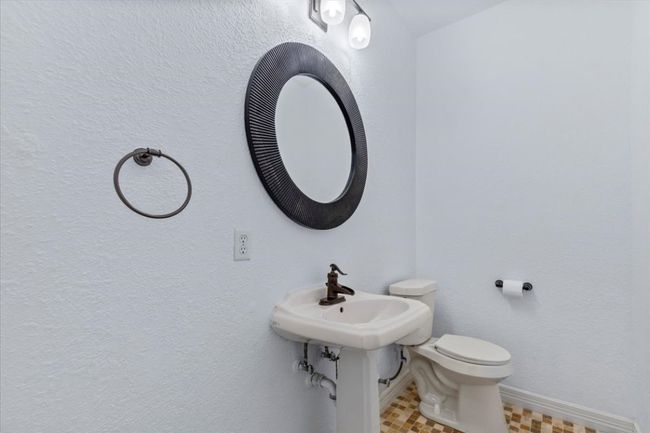 This half bath offers convenience for guests. | Image 23