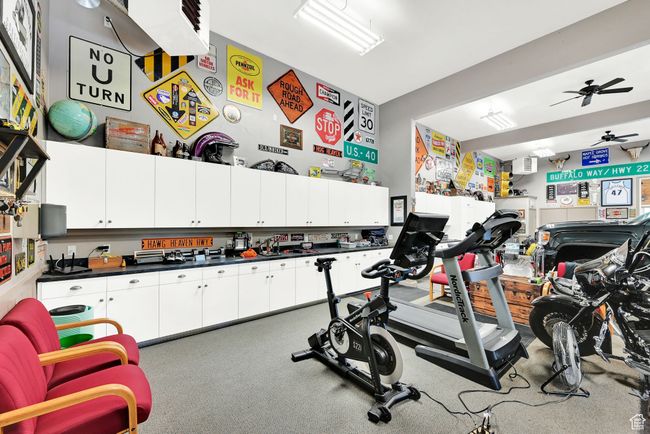 Exercise area featuring ceiling fan | Image 54