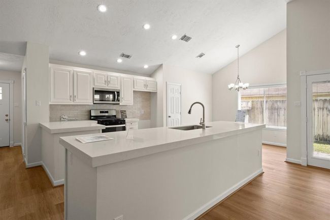 upgraded kitchen featuring elegant quartz countertops | Image 14
