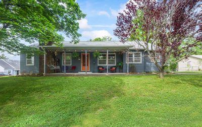 Mid-Century gem with updates galore! Modernized & impeccably maintained inside & out. | Image 1