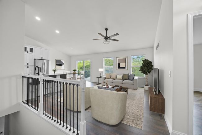 Living area featuring a healthy amount of sunlight, ceiling fan, dark wood-style flooring, and visible vents | Image 19