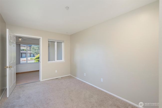 Bedroom #1 looking into sun room | Image 9