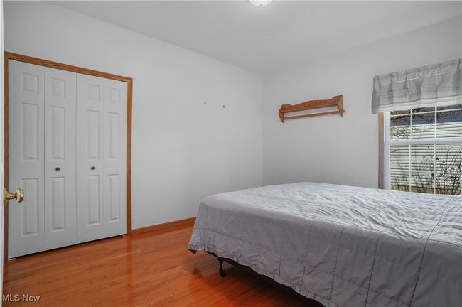 Bedroom featuring light wood-type flooring and a closet | Image 27