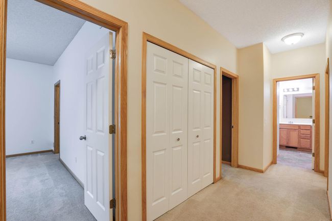 closet in loft area w/view of bedroom | Image 16