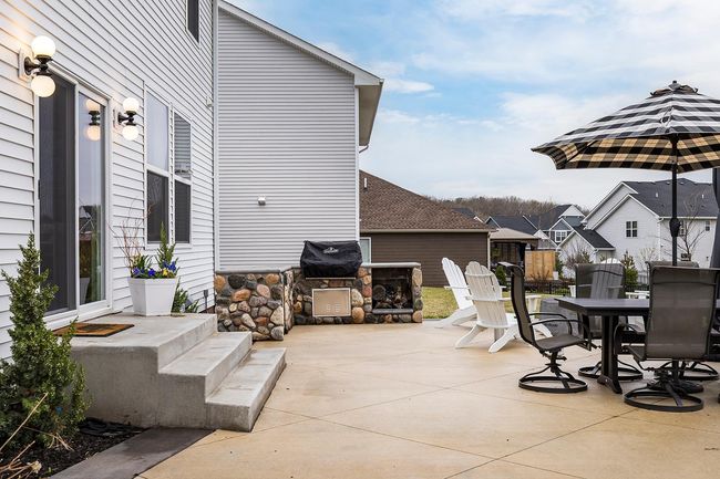 Outdoor kitchen with Napoleon grille and rotisserie + outdoor rated under counter fridge. | Image 39