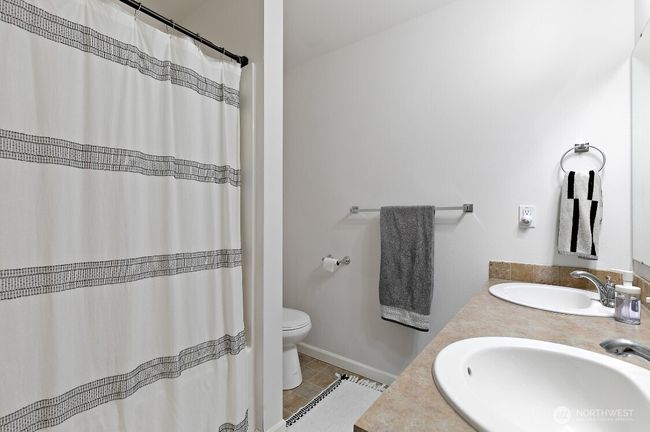 Spacious full bathroom featuring double sinks—perfect for shared use and busy mornings. | Image 14